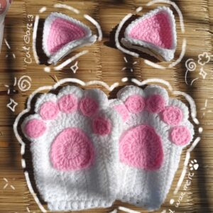 The Witches BD white and pink handmade crochet cat paw hand warmers and matching cat ear clips on a winter sale